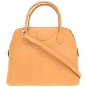 Pre-owned Leather handbags Hermès Vintage , Beige , Dames