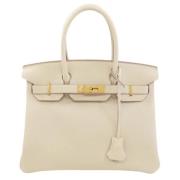 Pre-owned Leather handbags Hermès Vintage , Beige , Dames