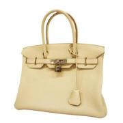 Pre-owned Leather handbags Hermès Vintage , Beige , Dames