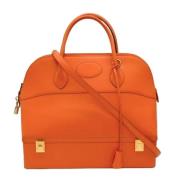 Pre-owned Leather handbags Hermès Vintage , Orange , Dames