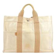 Pre-owned Canvas handbags Hermès Vintage , Beige , Unisex