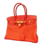 Pre-owned Leather handbags Hermès Vintage , Orange , Dames