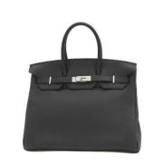 Pre-owned Leather handbags Hermès Vintage , Black , Dames