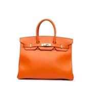 Pre-owned Leather handbags Hermès Vintage , Orange , Dames