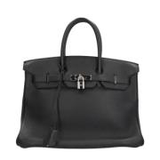 Pre-owned Leather handbags Hermès Vintage , Black , Dames