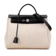 Pre-owned Canvas handbags Hermès Vintage , Beige , Dames