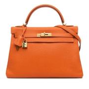 Pre-owned Leather handbags Hermès Vintage , Orange , Dames