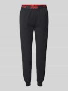 Relaxed fit sweatpants met elastische band met label, model 'SPORTY'