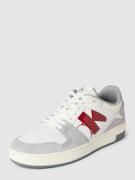 Leren sneakers met contrastgarnering