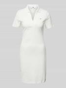 Knielange polojurk met logostitching