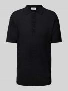 Relaxed fit poloshirt met knoopsluiting