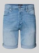 Korte tapered fit jeans met knoop- en ritssluiting