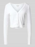 Kort gebreid jack met knoopsluiting