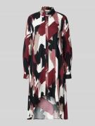 Overhemdjurk met blinde knoopsluiting.