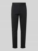 Korte stoffen broek met Franse steekzakken